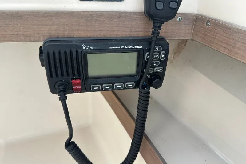 Slide: The Image of ICOM VHF marine radio on 1995 Grady-White Tournament 192 boat dashboard. - 26