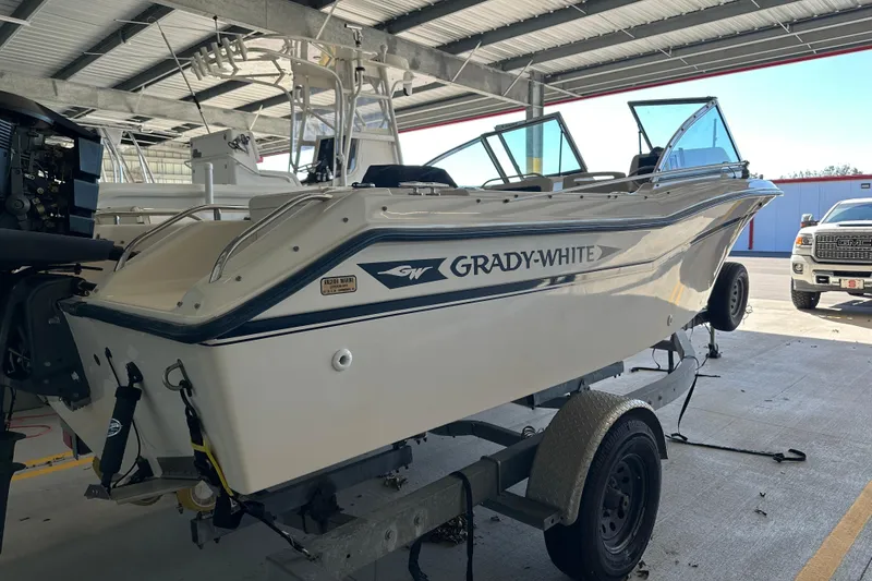 Slide: The Image of 1995 Grady-White Tournament 192 boat on trailer in covered storage area. - 3