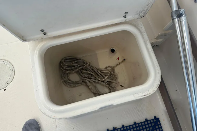 Slide: The Image of Storage compartment with rope on a 1995 Grady-White Tournament 192 boat. - 36