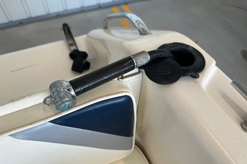 Slide: The Image of 1995 Grady-White Tournament 192 boat interior with fuel filler cap and hose. - 37