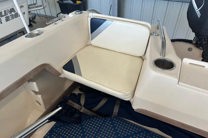 Slide: The Image of 1995 Grady-White Tournament 192 boat seat with cup holder and storage. - 39