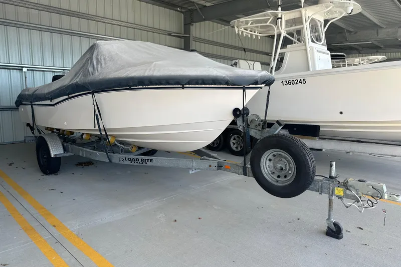 Slide: The Image of Covered 1995 Grady-White Tournament 192 boat on trailer in storage facility. - 4