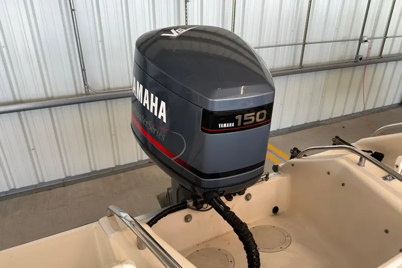 Slide: The Image of 1995 Grady-White Tournament 192 with Yamaha 150 V6 outboard motor in a garage. - 40