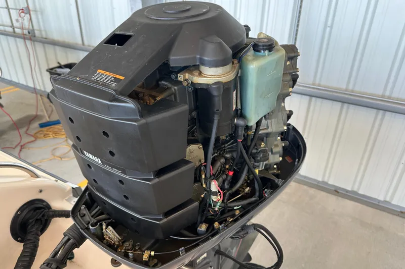 Slide: The Image of 1995 Grady-White Tournament 192 boat engine, Yamaha outboard, in a garage setting. - 42