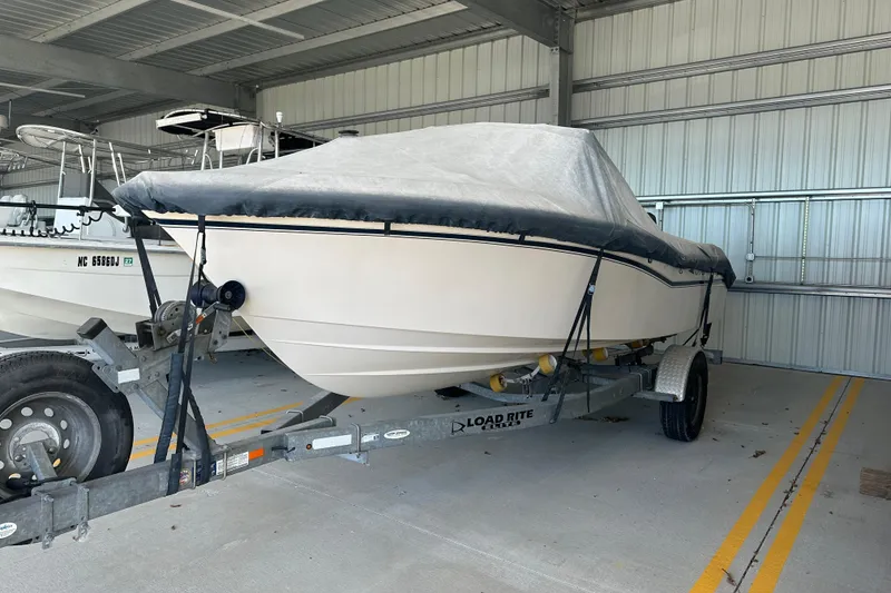 Slide: The Image of 1995 Grady-White Tournament 192 boat on trailer, covered and stored indoors. - 5