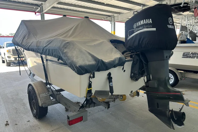 Slide: The Image of 1995 Grady-White Tournament 192 boat with Yamaha outboard motor, covered and on trailer. - 6