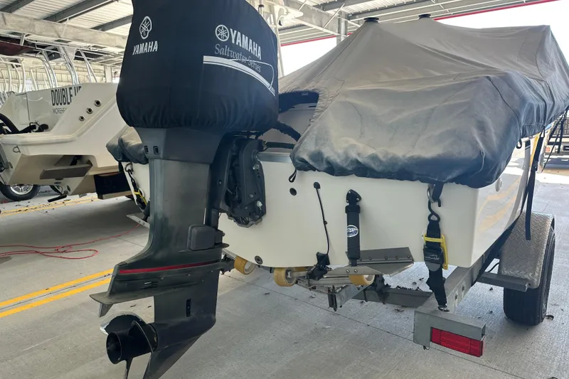 Slide: The Image of 1995 Grady-White Tournament 192 boat with Yamaha outboard motor, covered and on trailer. - 7