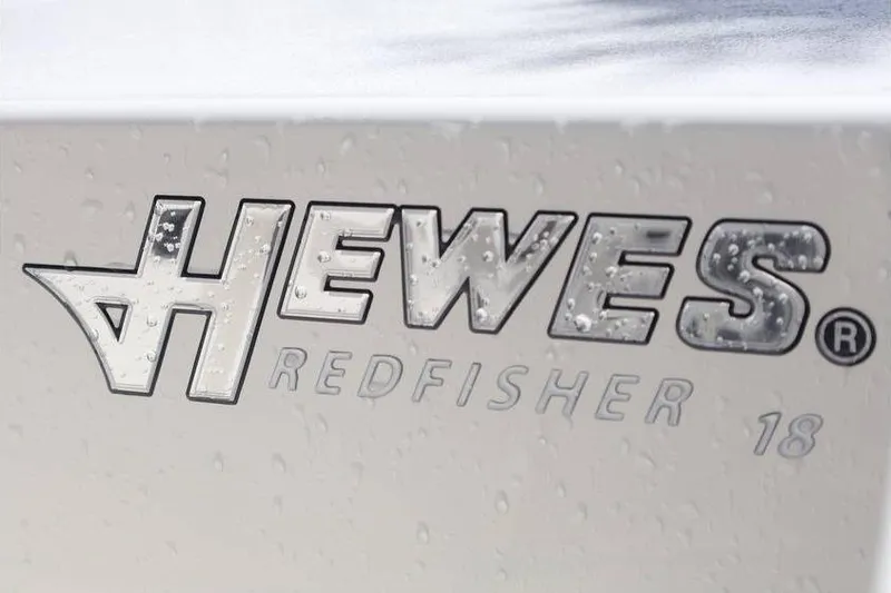 Slide: The Image of 2025 Hewes Redfisher 18 boat interior with cooler and seating arrangement. - 10