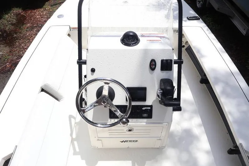 Slide: The Image of 2025 Hewes Redfisher 18 logo on white upholstery. - 8