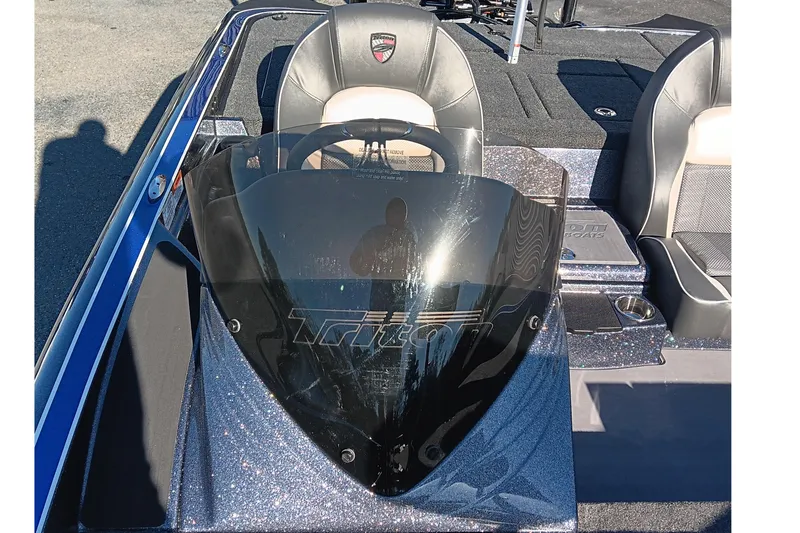 Slide: The Image of 2026 Triton 18 TrX boat deck with Garmin equipment and trolling motor. - 10