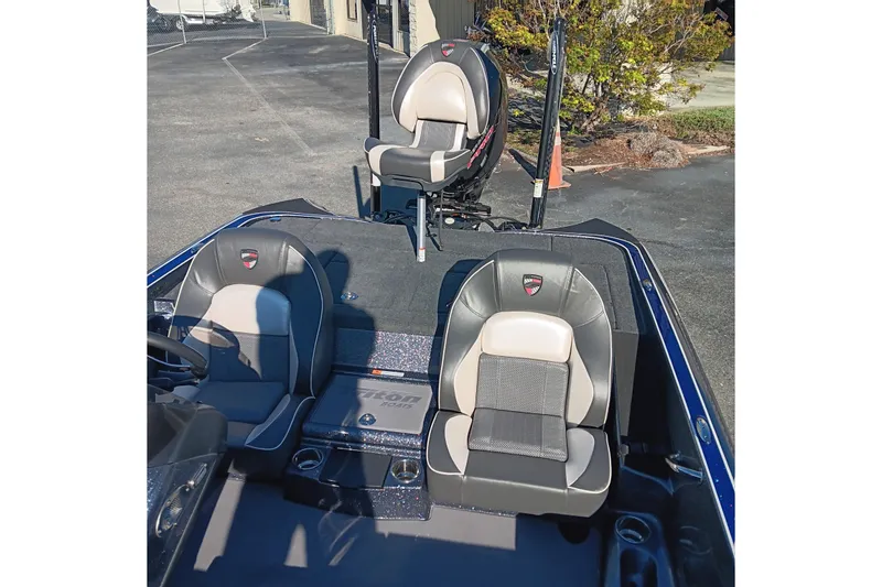 Slide: The Image of 2026 Triton 18 TrX boat cockpit with steering wheel and seats, featuring a sleek design. - 11