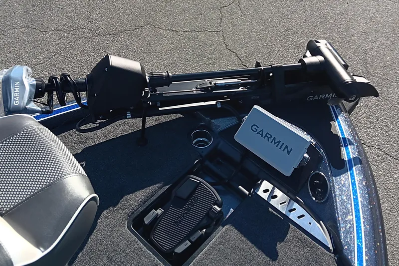 Slide: The Image of 2026 Triton 18 TrX boat with Garmin trolling motor in a dealership lot. - 8