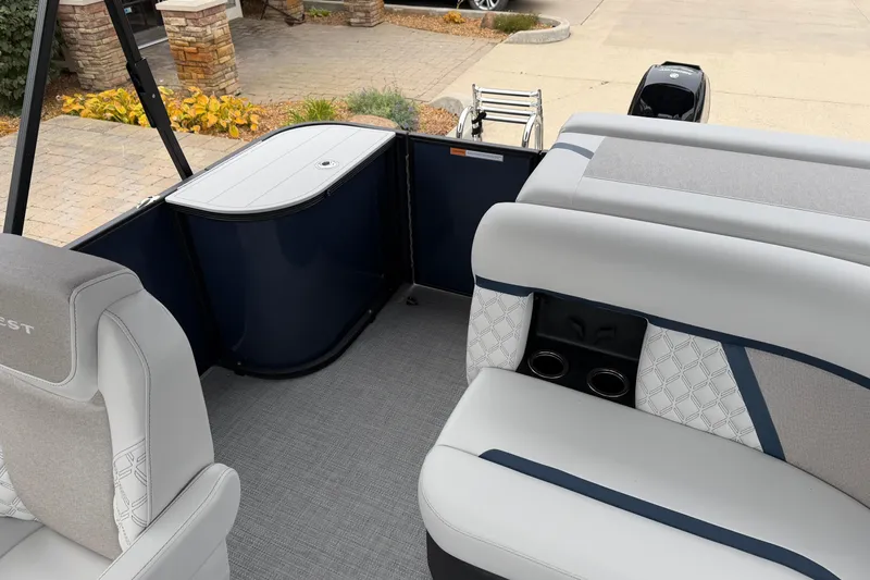 Slide: The Image of 2026 Crest Conquest 210 L boat interior with stylish seating and modern design. - 13