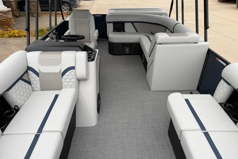 Slide: The Image of 2026 Crest Conquest 210 L pontoon boat interior with luxurious seating and modern design. - 5