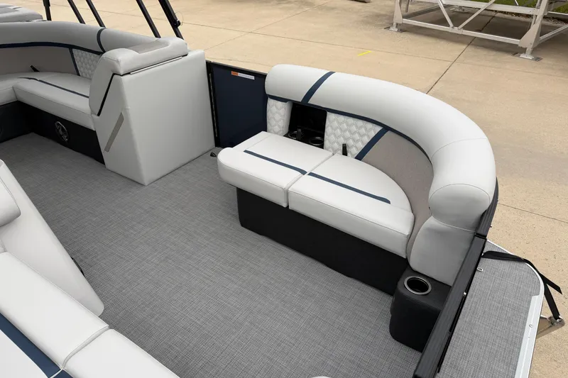 Slide: The Image of 2026 Crest Conquest 210 L pontoon boat interior with plush seating and modern design. - 6