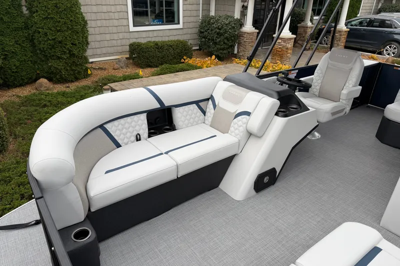 Slide: The Image of 2026 Crest Conquest 210 L boat interior with luxurious seating and modern design. - 7