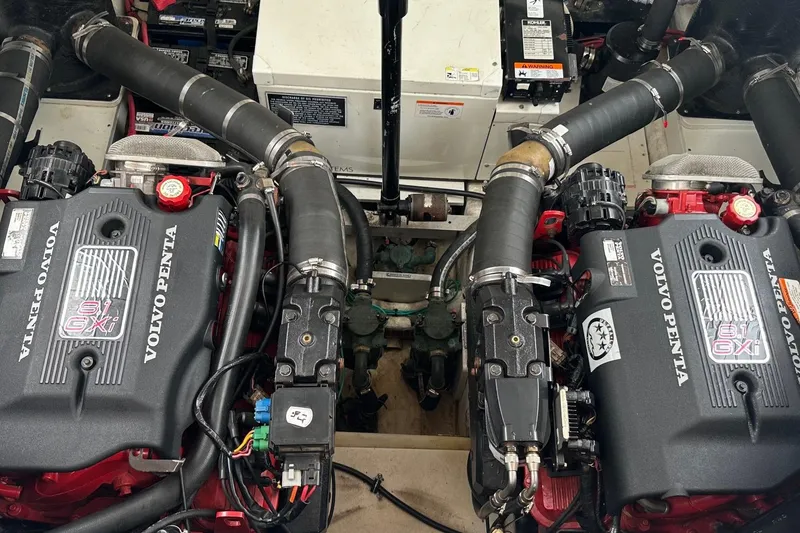 Slide: The Image of Twin Volvo Penta engines in a 2004 Larson 370 boat engine compartment. - 13