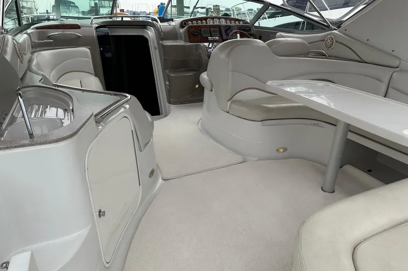 Slide: The Image of Interior of a 2004 Larson 370 boat with seating and control panel. - 6