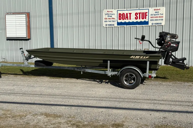 The Image of 2025 Alweld 1442 DS boat on trailer outside a boat supply store. - 1