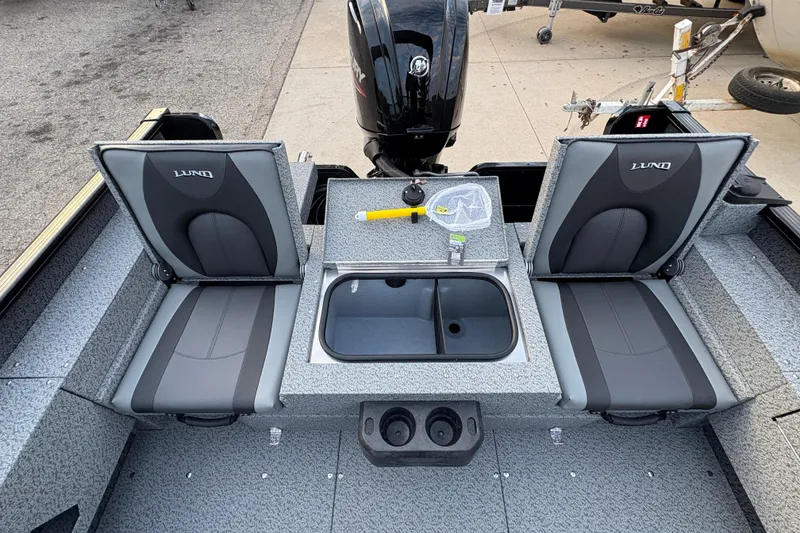 Slide: The Image of 2026 Lund 1775 Adventure Sport boat interior with seating and storage compartments. - 20