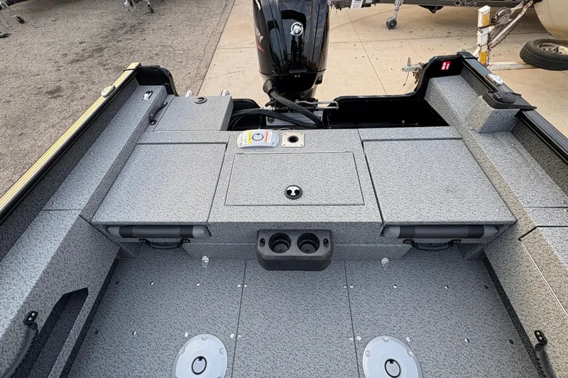 Slide: The Image of 2026 Lund 1775 Adventure Sport boat interior with storage compartments and motor. - 21