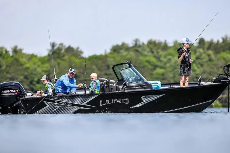 Slide: The Image of Manufacturer Provided Image: 2026 Lund 1775 Adventure Sport boat with family fishing on a lake. - 30