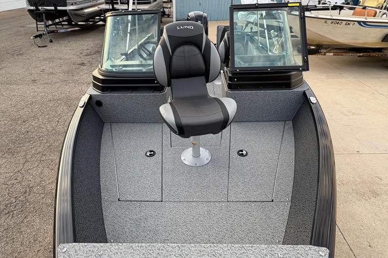 Slide: The Image of 2026 Lund 1775 Adventure Sport boat interior with seating and windshield. - 6