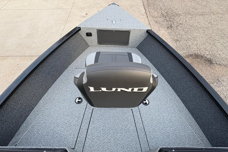 Slide: The Image of 2026 Lund 1775 Adventure Sport boat interior with branded seat and textured flooring. - 7