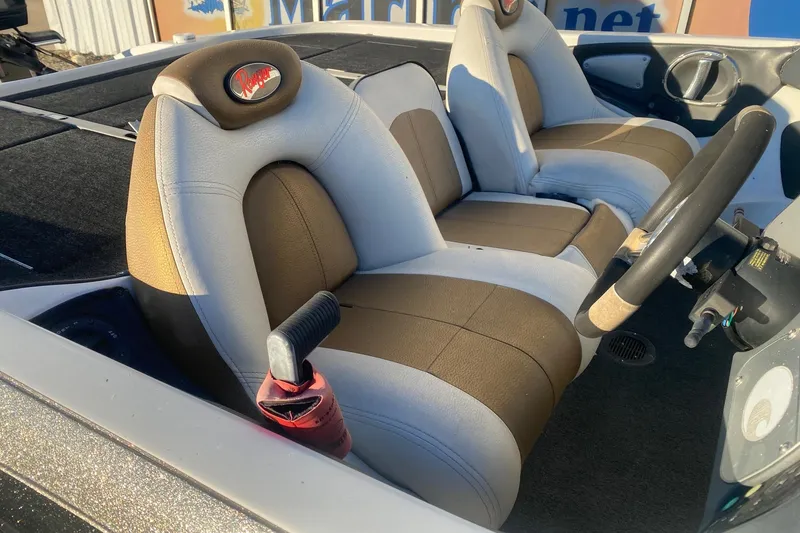 Slide: The Image of 2006 Ranger Z20 Comanche boat interior with dual seats and steering wheel. - 7