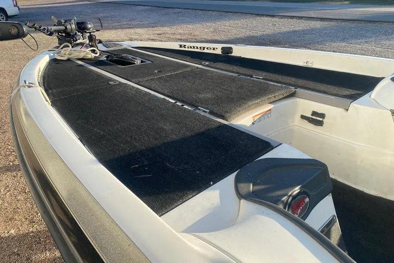 Slide: The Image of 2006 Ranger Z20 Comanche boat deck with trolling motor and storage compartments. - 8