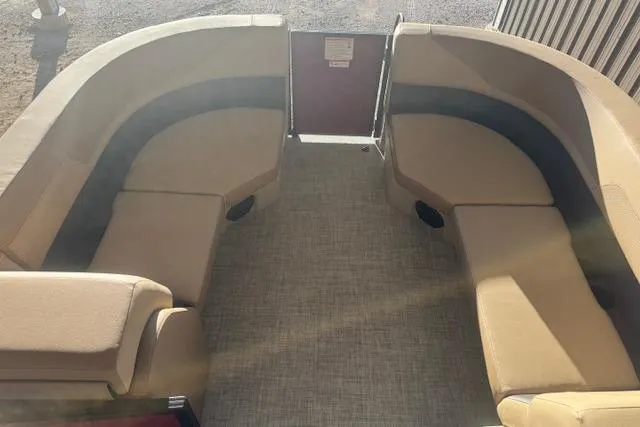 Slide: The Image of 2026 Lowe LS 170 boat interior with beige seating and carpeted floor. - 10