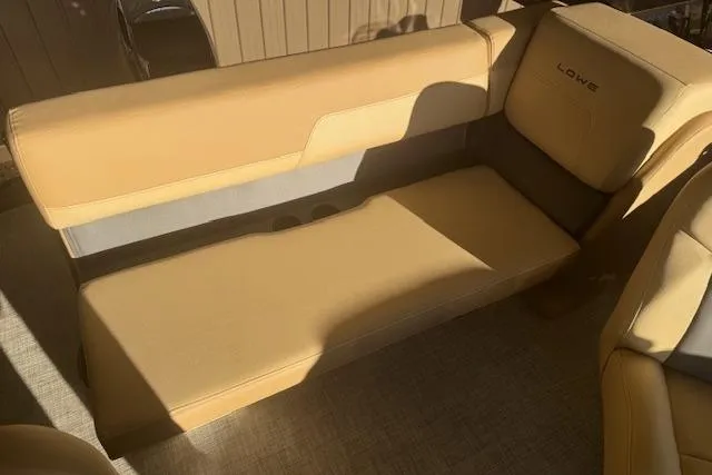 Slide: The Image of 2026 Lowe LS 170 boat interior with beige seating and modern design. - 18