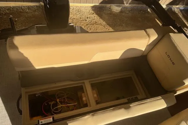 Slide: The Image of Interior of 2026 Lowe LS 170 boat showing storage compartment and seating. - 19