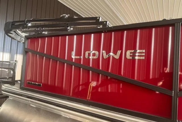 Slide: The Image of 2026 Lowe LS 170 boat with red paneling and sleek design. - 4