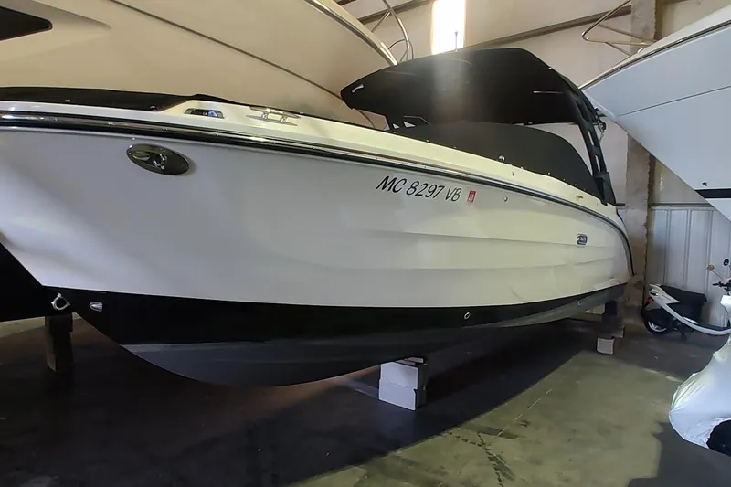 The Image of 2025 Sea Ray SDX 270 Outboard boat in storage, side view. - 0