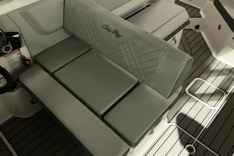 Slide: The Image of 2025 Sea Ray SDX 270 Outboard interior seating with elegant gray upholstery and modern design. - 15