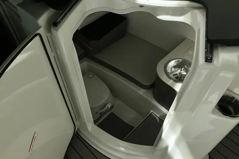 Slide: The Image of 2025 Sea Ray SDX 270 Outboard interior cabin with toilet and sink. - 17