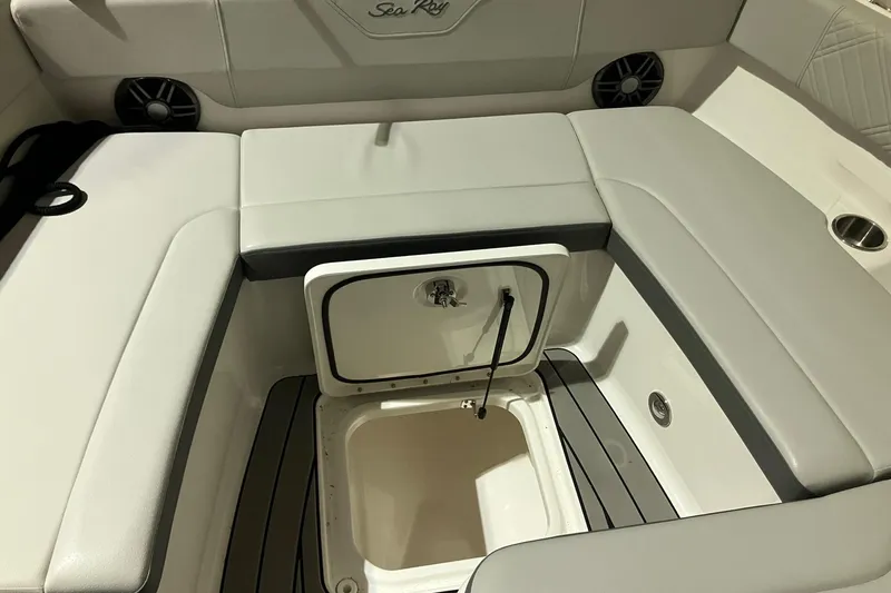 Slide: The Image of 2025 Sea Ray SDX 270 Outboard boat seating with storage compartment open. - 21