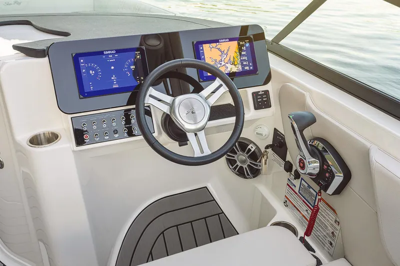Slide: The Image of 2025 Sea Ray SDX 270 Outboard interior with white seating and sleek design. - 7