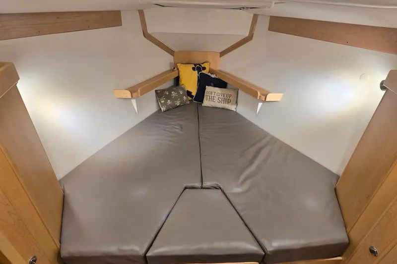 Slide: The Image of Cozy cabin interior of 2018 Tartan 345 sailboat with cushions and decorative pillows. - 22