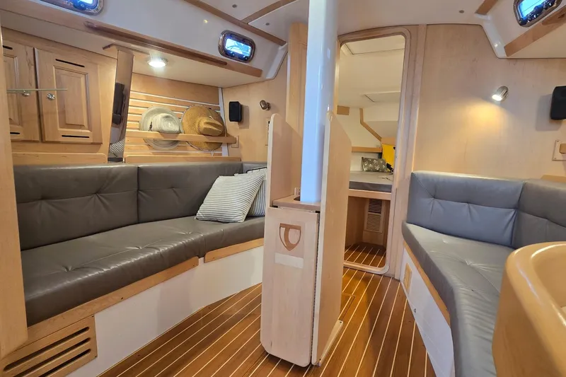 Slide: The Image of Luxurious interior of 2018 Tartan 345 yacht with cozy seating and elegant wood finishes. - 27