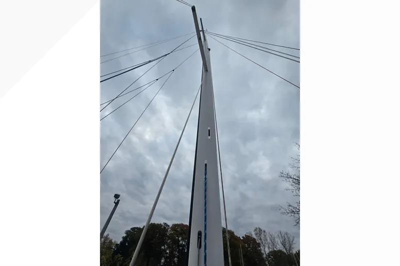 Slide: The Image of Tall mast of 2018 Tartan 345 sailboat against cloudy sky. - 28