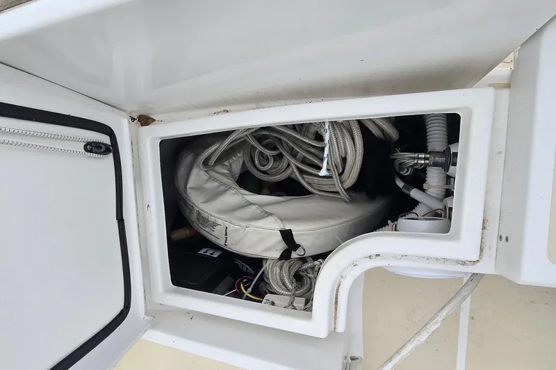 Slide: The Image of Storage compartment on a 2018 Tartan 345 sailboat, containing ropes and equipment. - 29