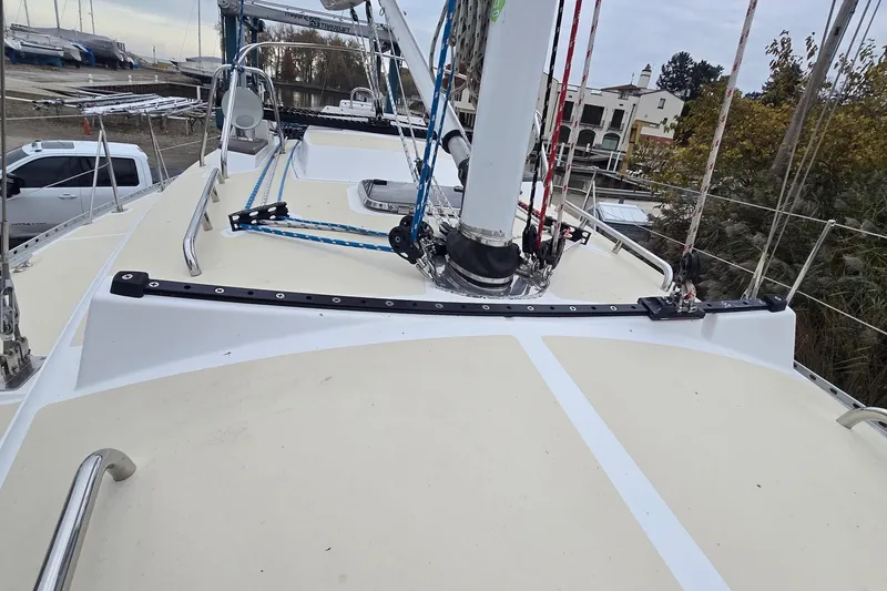 Slide: The Image of 2018 Tartan 345 sailboat deck with rigging and mast in marina setting. - 30