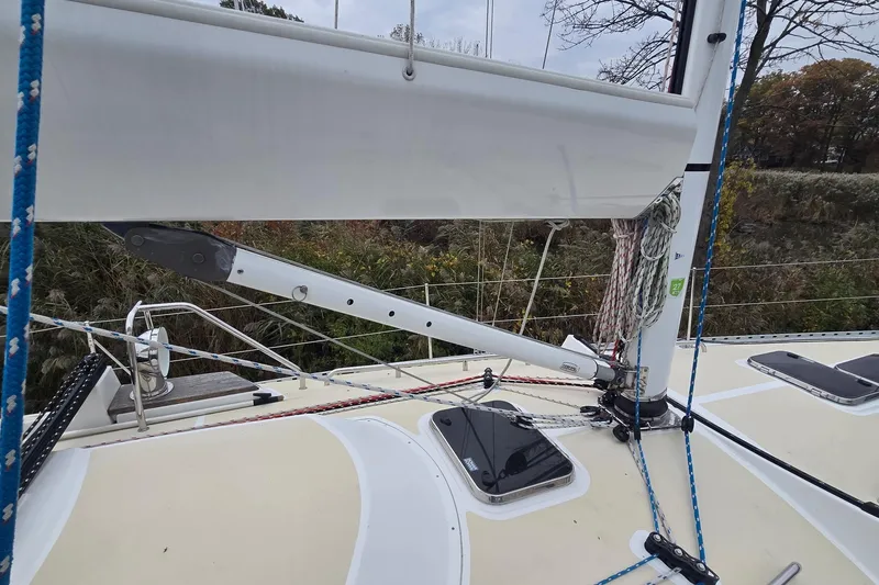 Slide: The Image of Sailboat deck of 2018 Tartan 345, featuring rigging and boom details. - 39