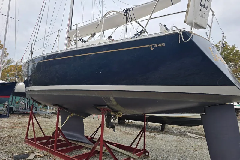 Slide: The Image of Sailboat Tartan 345, 2018 model, on dry dock with visible keel and hull. - 4