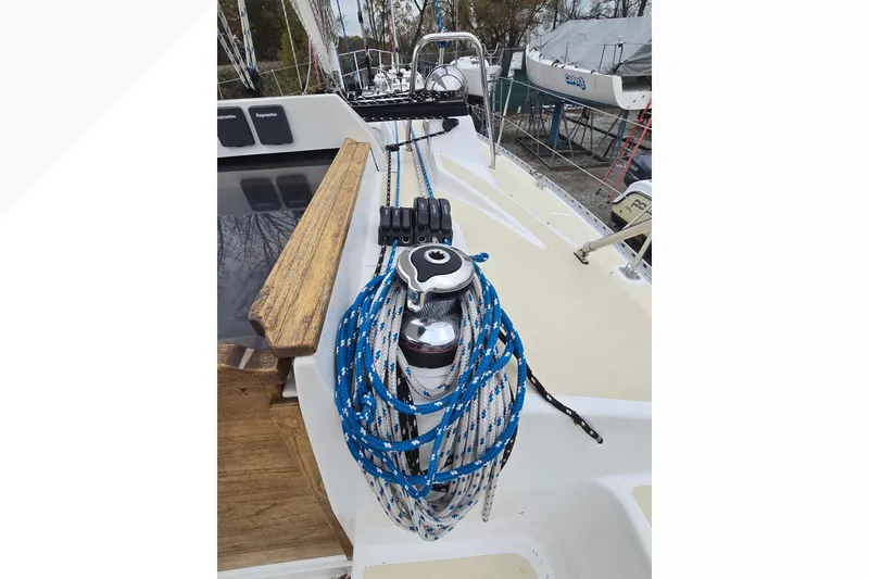 Slide: The Image of 2018 Tartan 345 sailboat deck with winch and blue ropes. - 41
