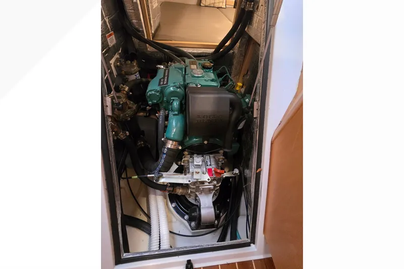 Slide: The Image of Engine compartment of a 2018 Tartan 345 sailboat, featuring a Volvo Penta engine. - 48
