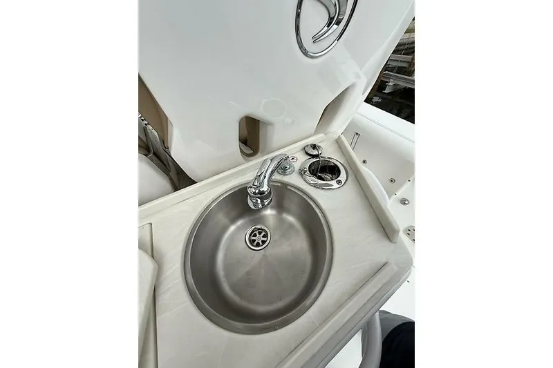 Slide: The Image of Stainless steel sink on 2022 Edgewater 262CC boat, featuring modern faucet and clean design. - 23