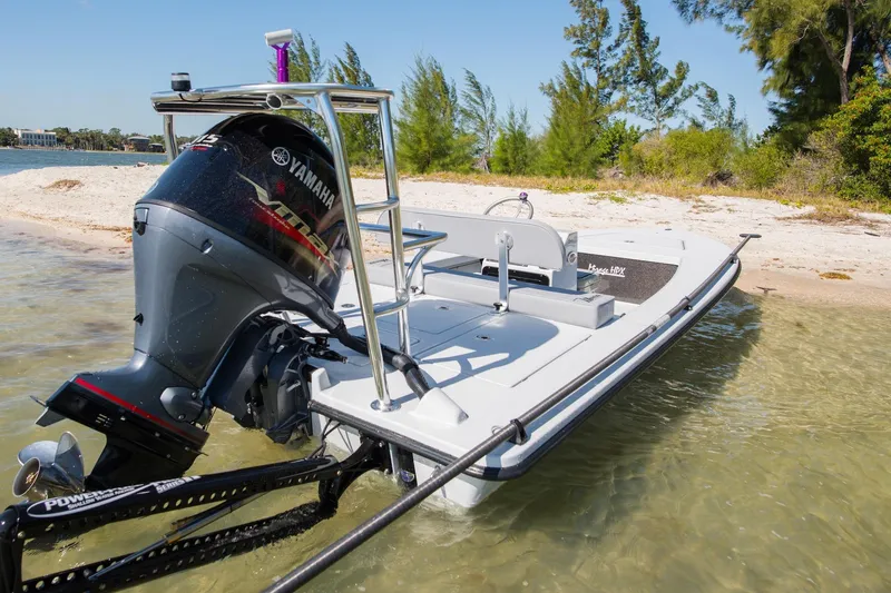 Slide: The Image of 2026 Maverick 18 HPX-V boat with Yamaha engine on sandy shore. - 11
